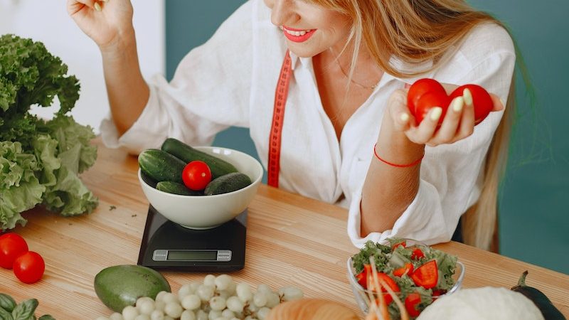 Woman Weighing Vegetables