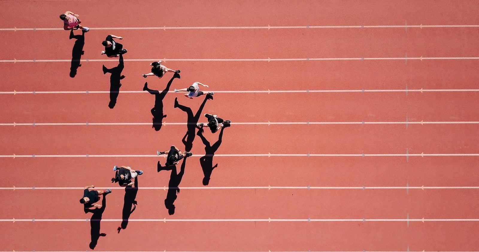 group of people running on stadium