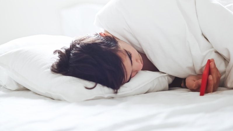 woman lying on bed