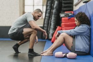 Black sportive couple in gym during break
